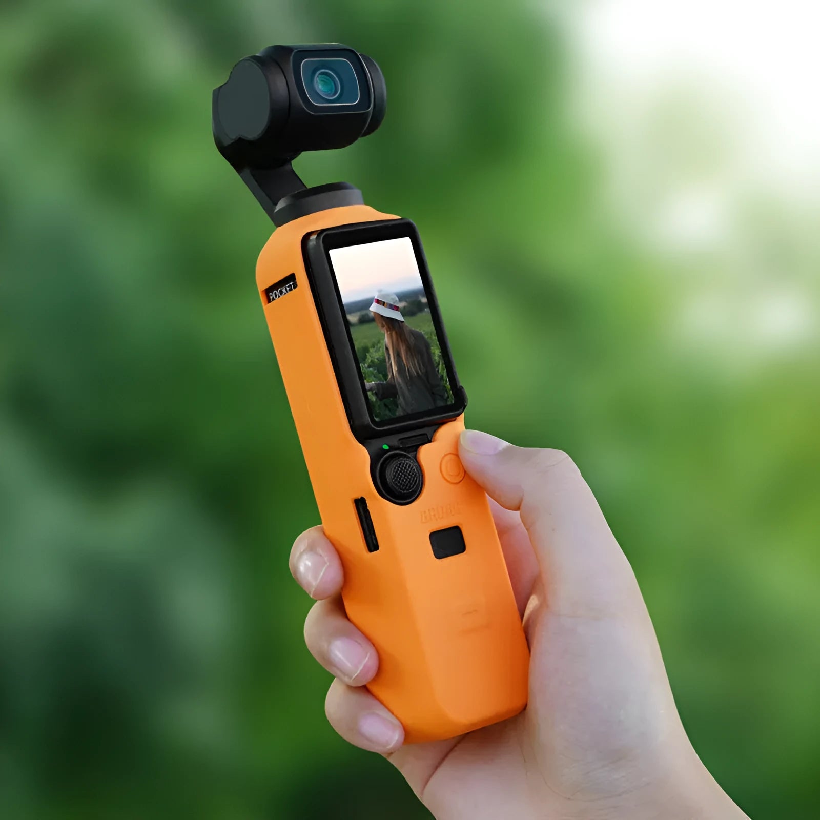Black silicone protective sleeve for a PTZ camera, shown next to red and orange versions.