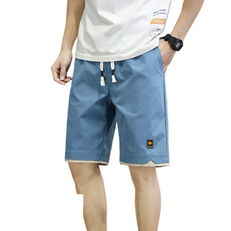 Man and woman modelling loose-fit casual beach shorts in South Korea style, available in multiple colours.