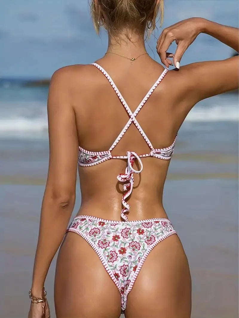 Women's V-neck swimsuit with embroidered detail and floral printed pattern in briefs style