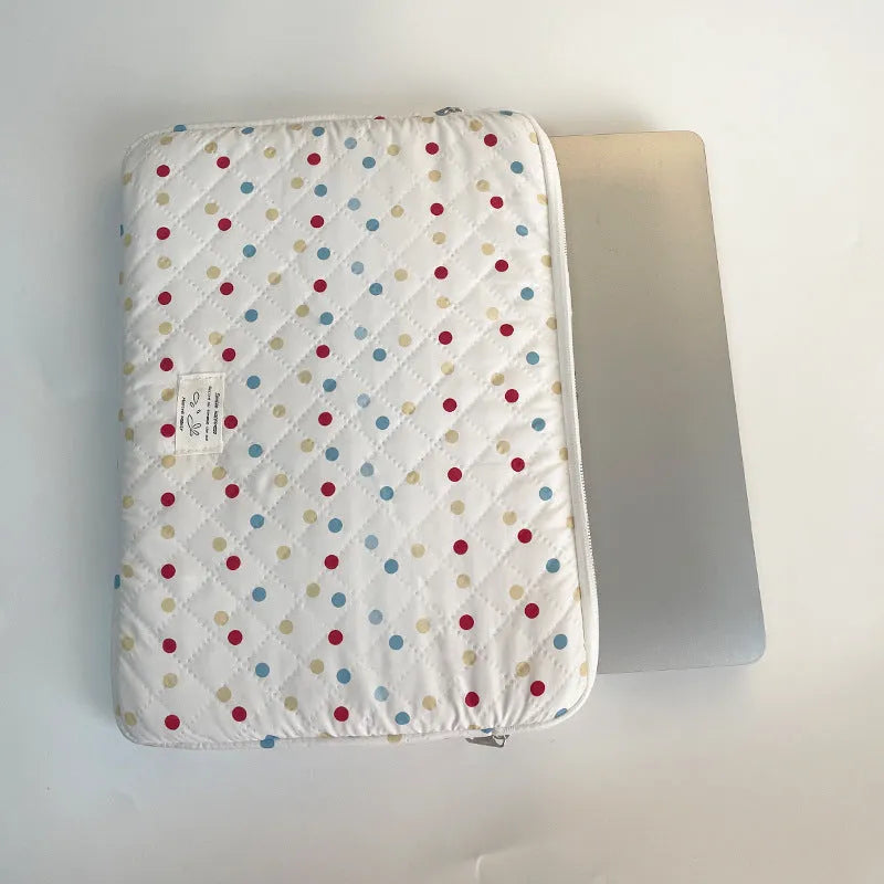 Polka dot patterned laptop bag for women, shown in available sizes for 11-inch to 15.6-inch laptops.