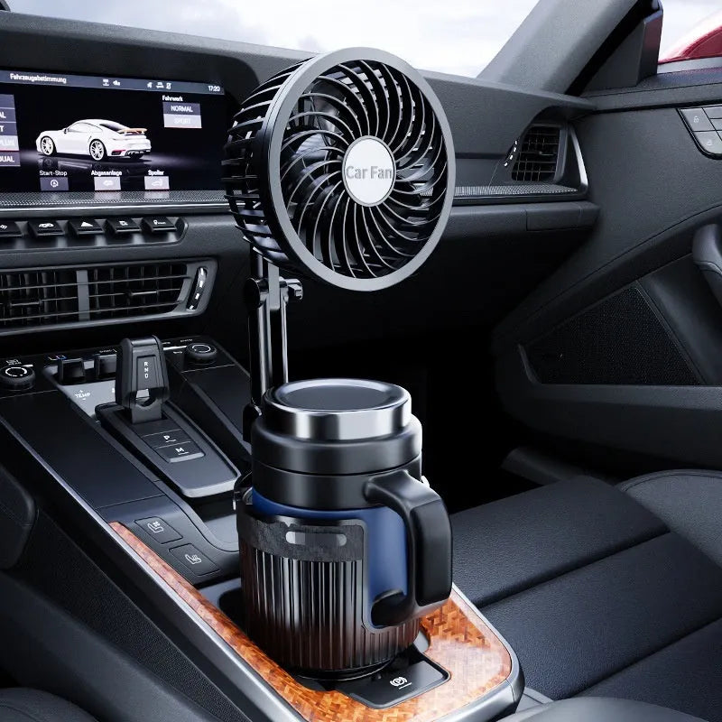 A car cup holder fan with black ABS plastic housing inserted into a vehicle's centre console.