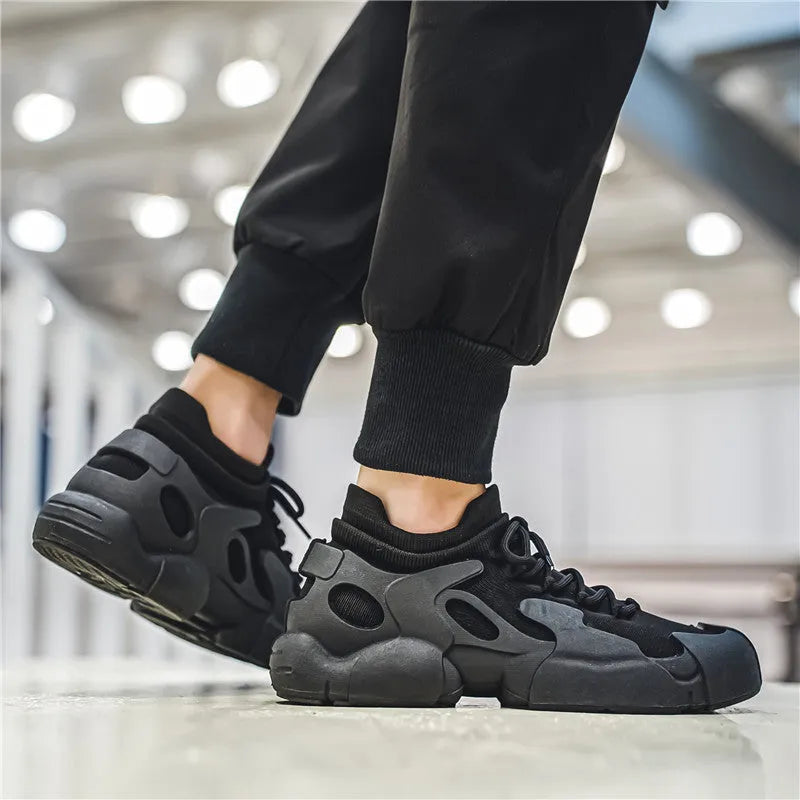 Women's breathable fly woven mesh lace-up hiking shoes in black, low top with rubber sole and cross strap detail