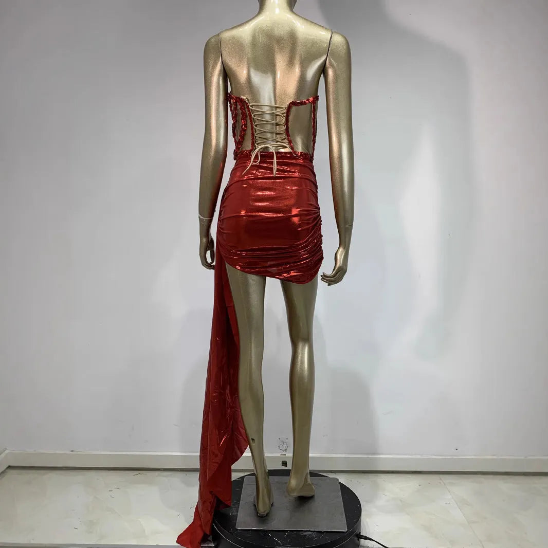 Red two-piece stage costume skirt suit with see-through mesh panels and a form-fitting spandex design.