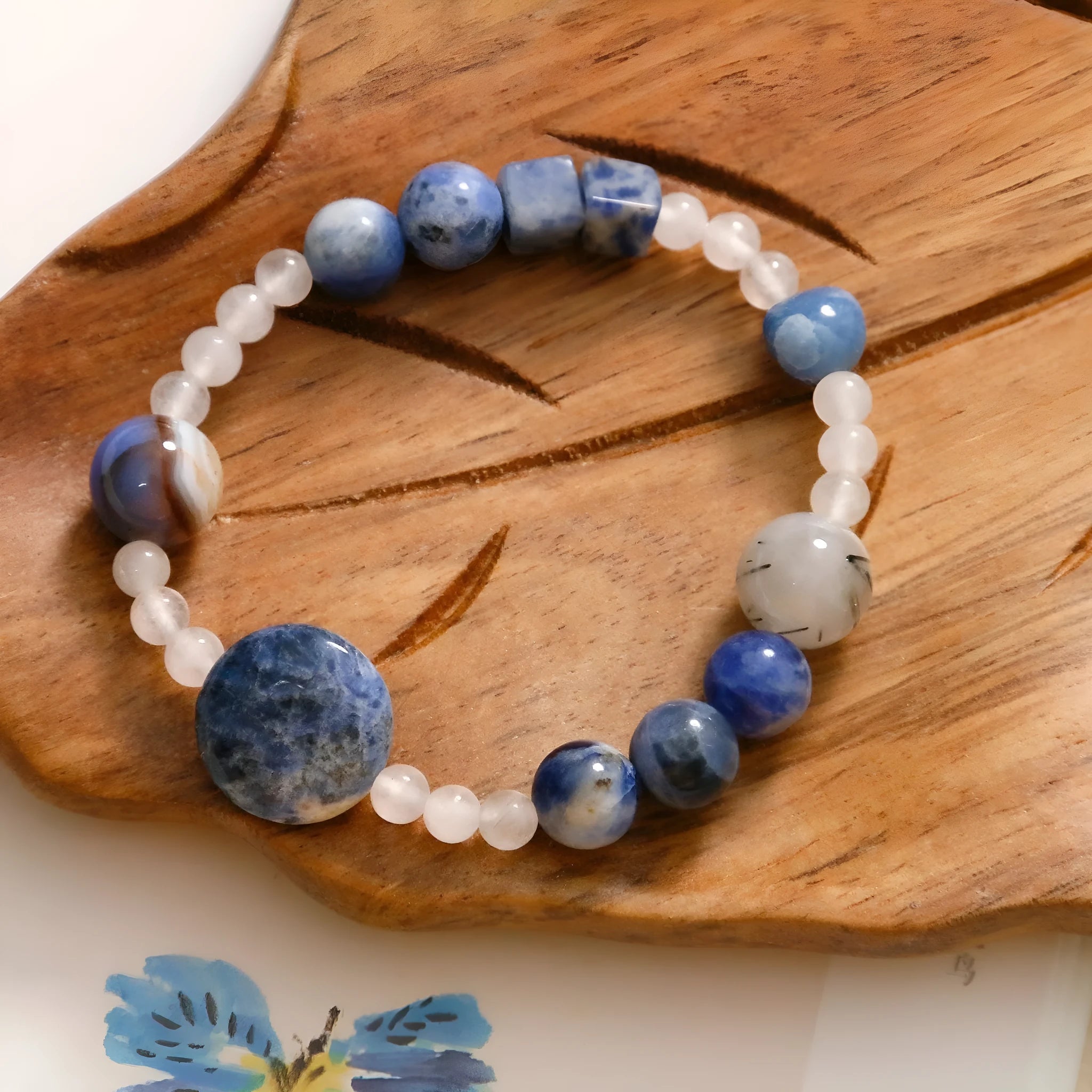 Hand-woven natural blue point stone and black hair crystal agate bracelet with geometric design