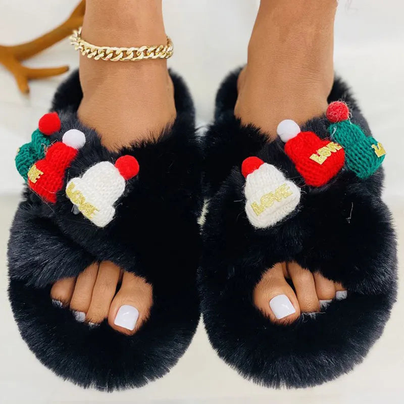 Women's festive slippers with Christmas hat decoration on hairy faux plush upper, shown in black, khaki, or white.