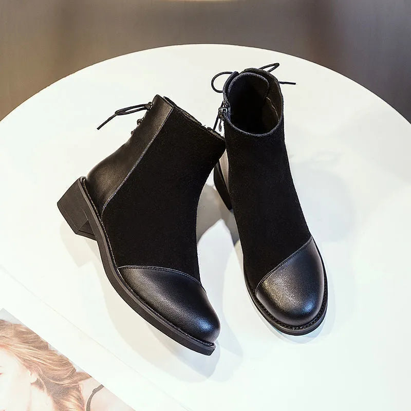 Black women's knee-high Martin boots with side zip and bow detail on a microfibre upper.