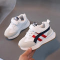 Children's white synthetic leather sneaker with Velcro strap and rubber sole
