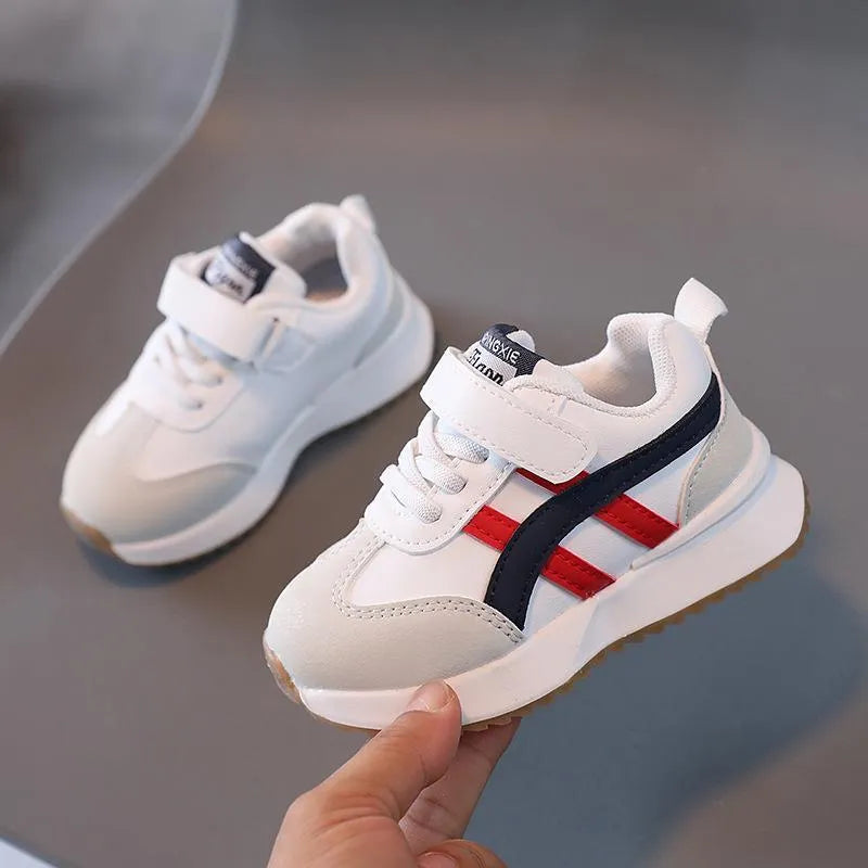 Children's white synthetic leather sneaker with Velcro strap and rubber sole