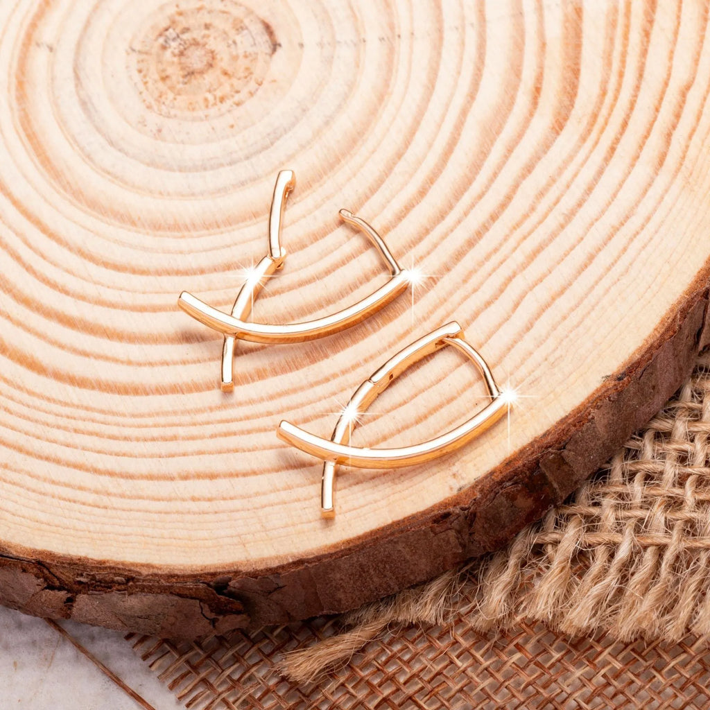 Rose gold plated cross-shaped earrings showing front design with post fitting.