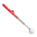 A telescopic stainless steel golf swing trainer extended to full height on a green background.