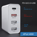 White multi-port USB fast charger with PD and QC support plugged into a wall socket.