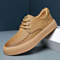 Men's brown and black lace-up casual platform trainers with a round toe and flat heel.