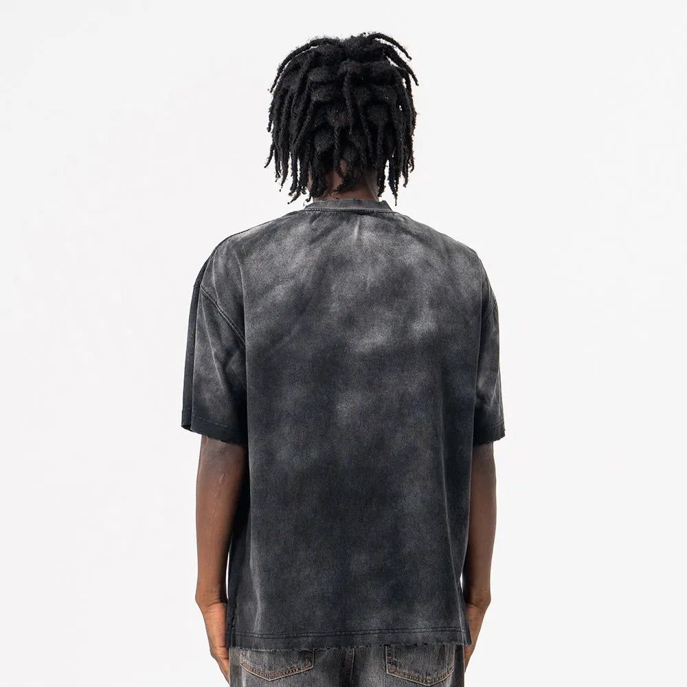 Men's black loose fit cotton t-shirt with drop-shoulder sleeves and white letter pattern print.