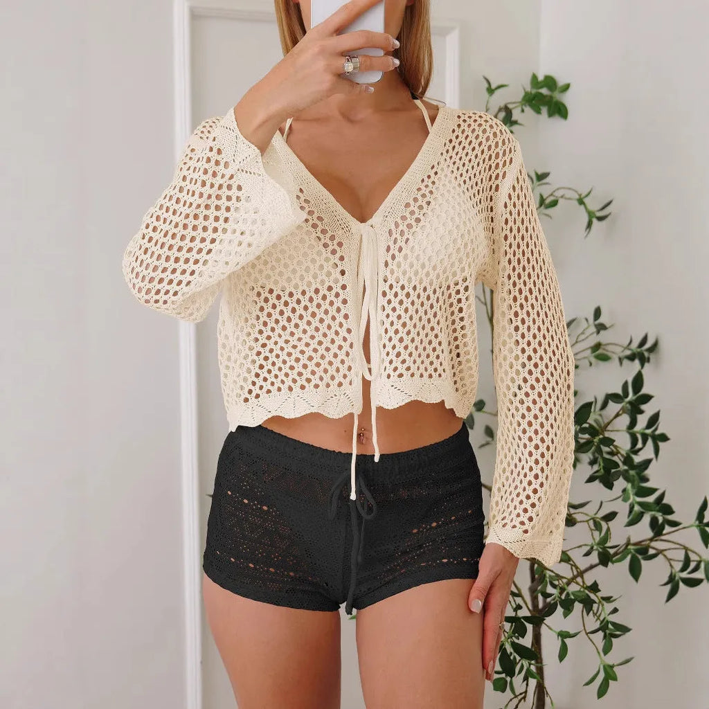 Short length women's cardigan blouse with bell sleeves in apricot colour.