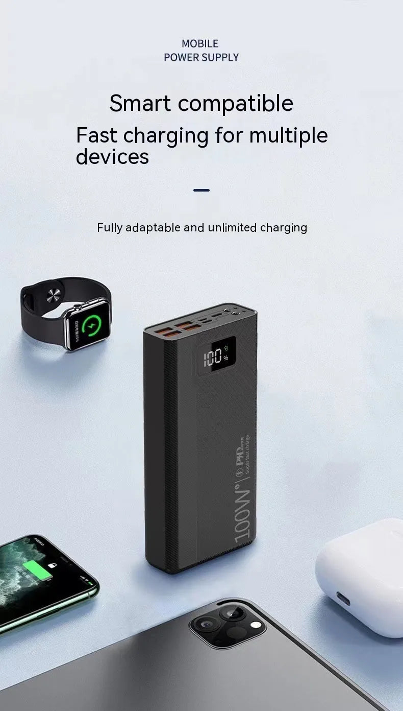 Large black and white power bank showing size comparison next to a mobile phone.