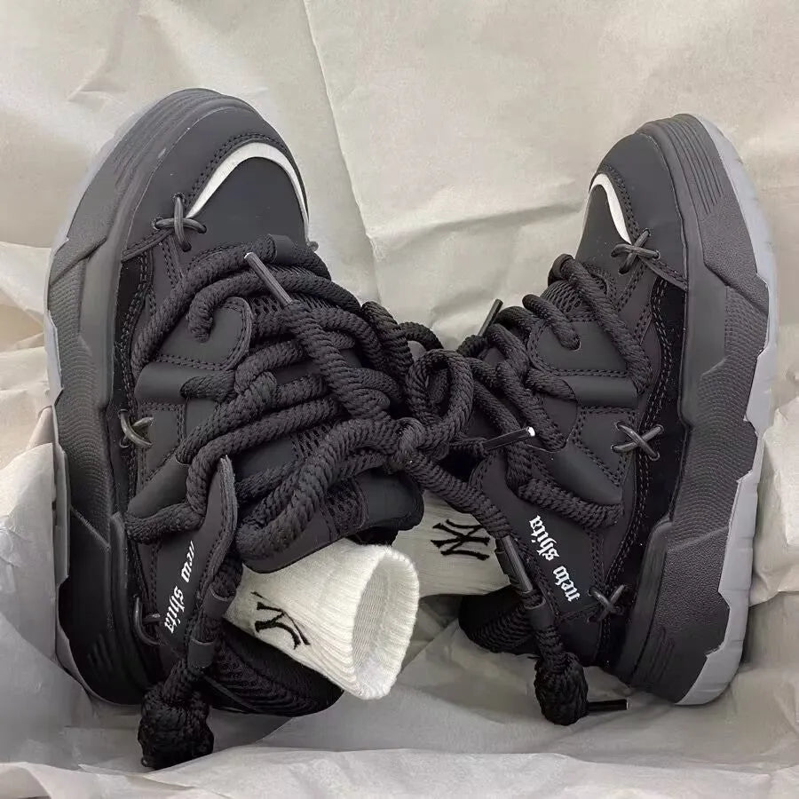 Women's grey chunky platform sneakers with thick soles and lace-up front