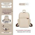 Large canvas travel backpack for women showing multiple internal compartments and zippered pockets