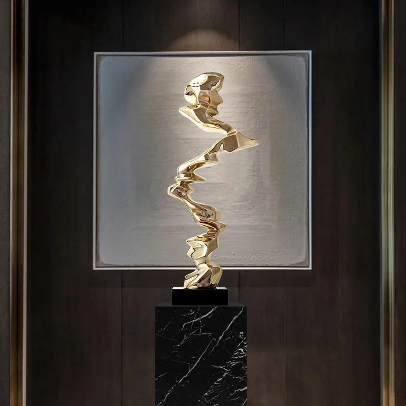 Ran Ran Rose abstract resin sculpture in bright gold, silver, or blue on a neutral background.