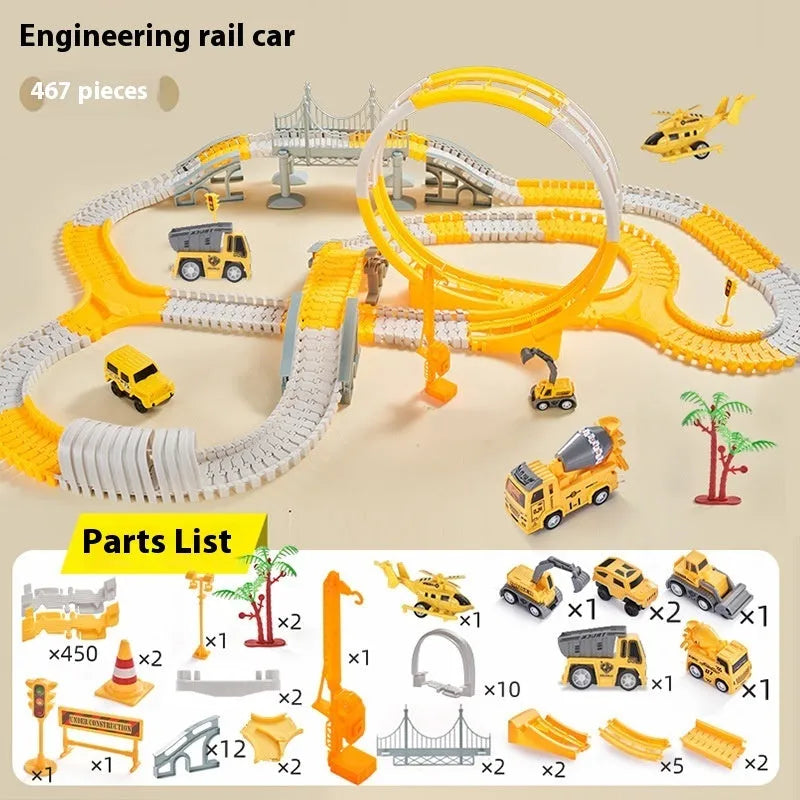 Rail car toy set with plastic track pieces and two electric vehicles in assorted colours