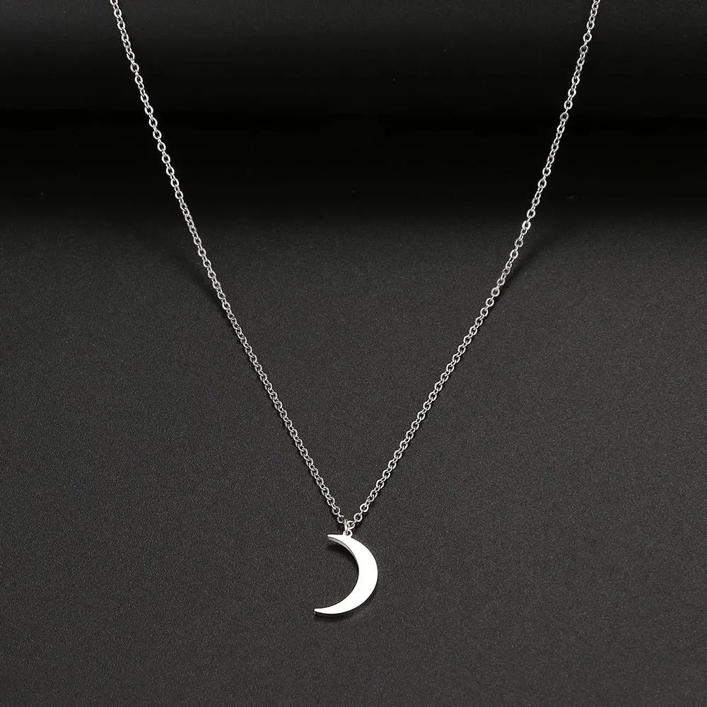 Women's stainless steel moon pendant necklace on a clavicle chain in gold or silver electroplated finish