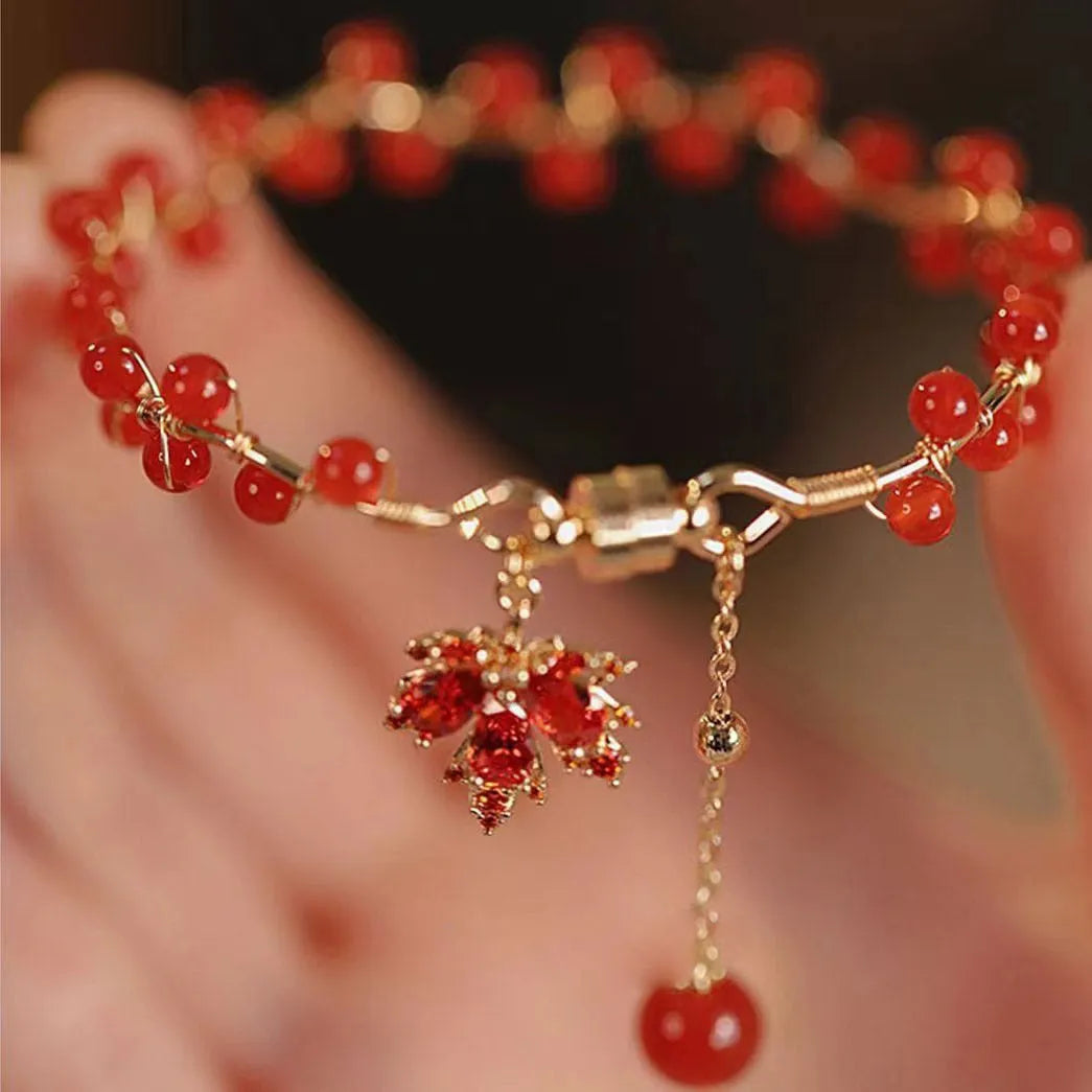 Red ginkgo leaf charm on an alloy magnetic bracelet in a Chinese style.