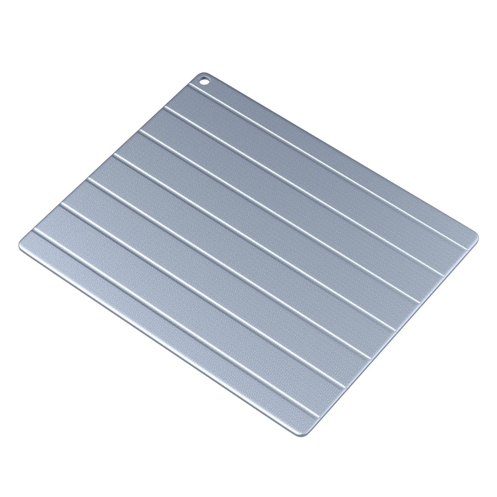 Aluminium food defrosting plate on a kitchen countertop, shown with a USB cable