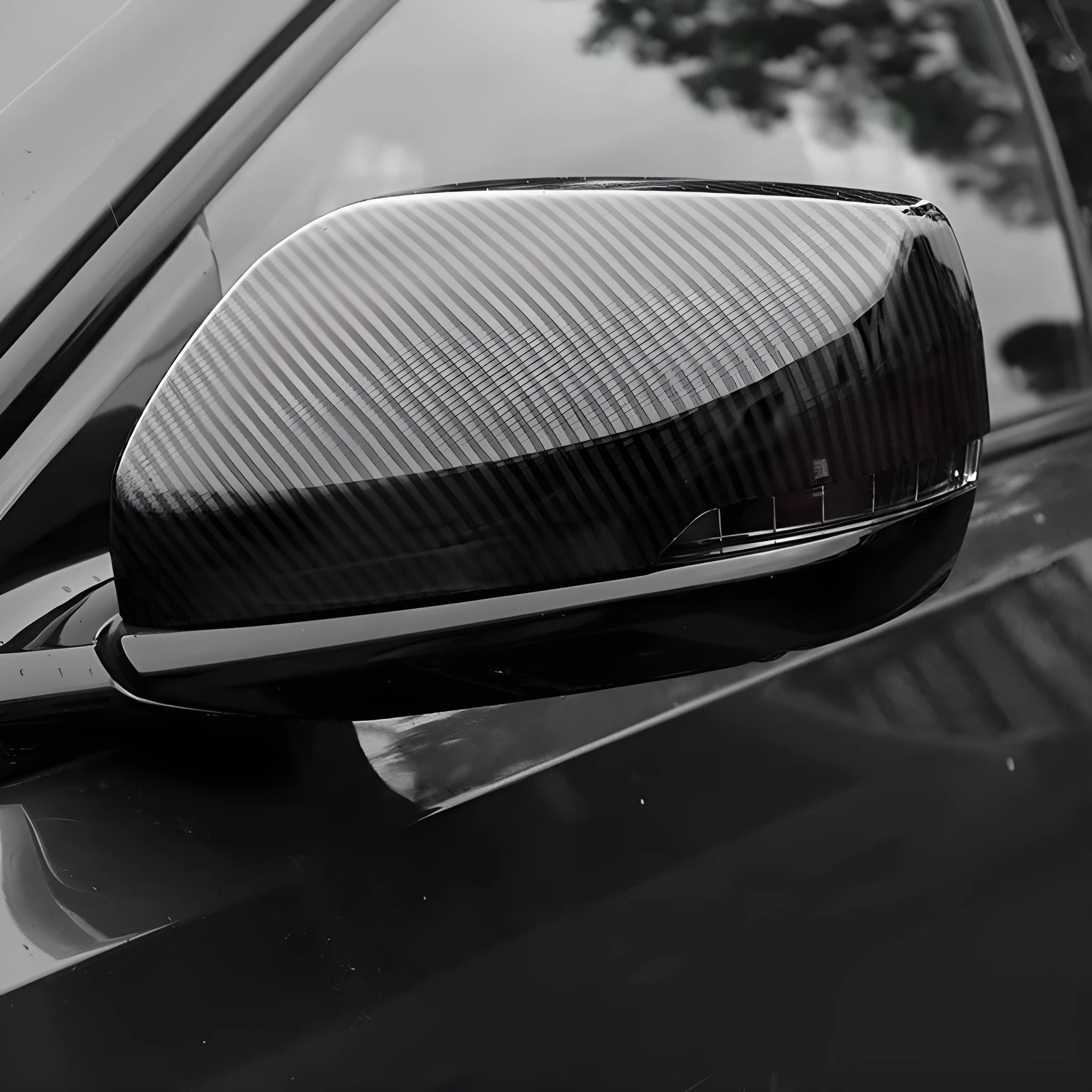 ABS plastic rearview mirror cover for Cadillac CT5 and CT6 models in carbon fibre, silver, or rain frame pattern.