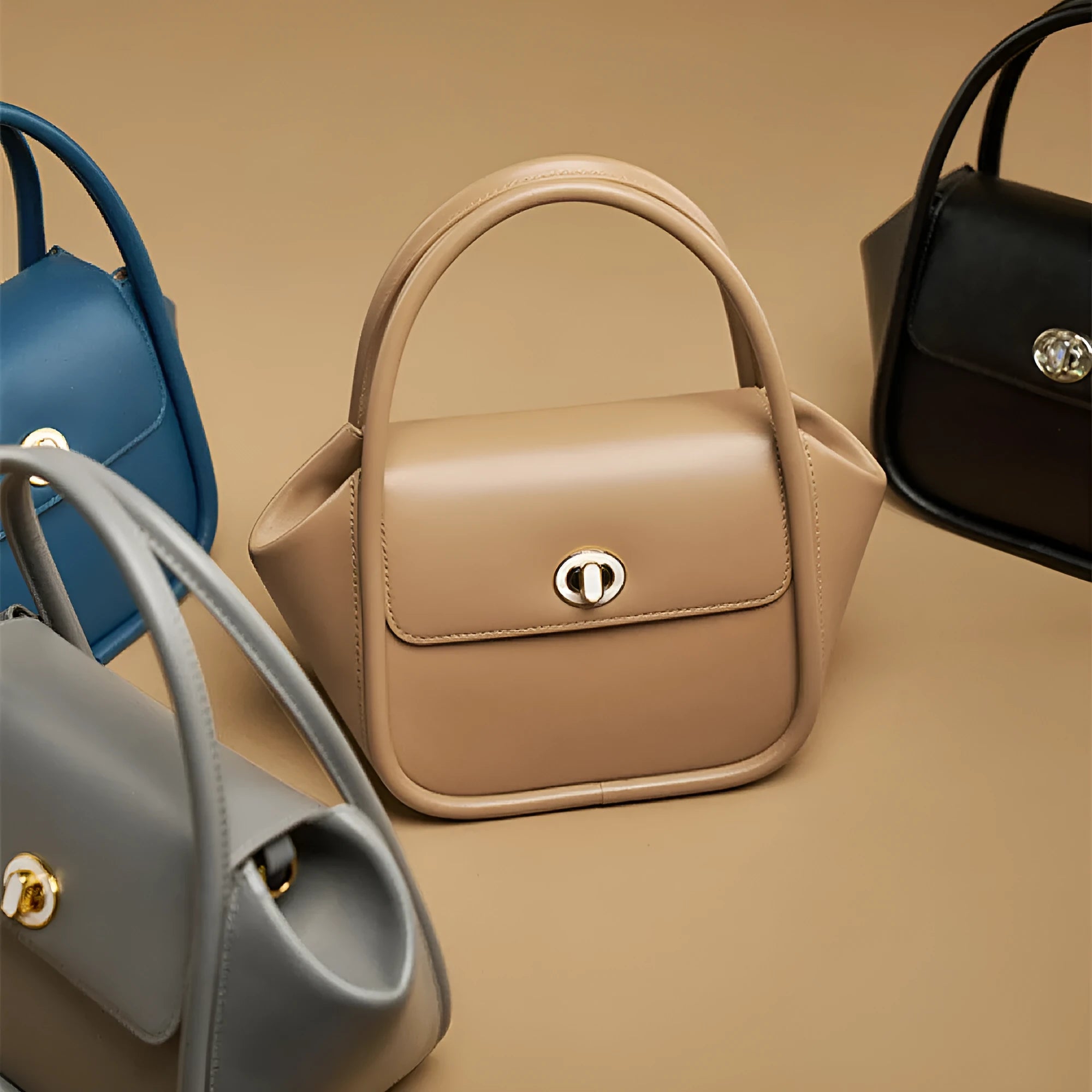 Winged shape leather tote handbag with a buckle and cross-body strap in cow leather