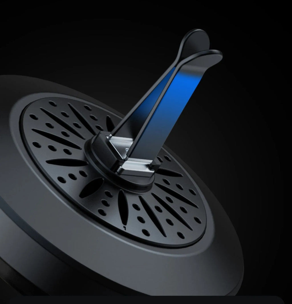 Car air vent clip-on aromatherapy unit with RGB 3D projection light.