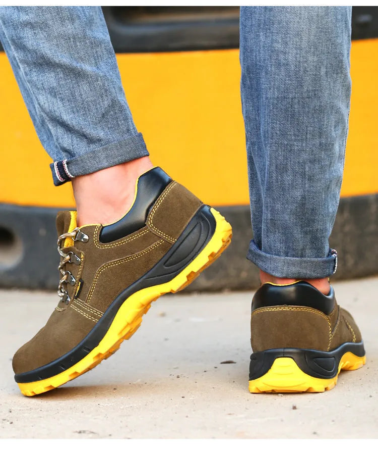 Bronze coloured low-cut cow suede leather safety shoes with a steel toe cap on a patterned non-slip sole.