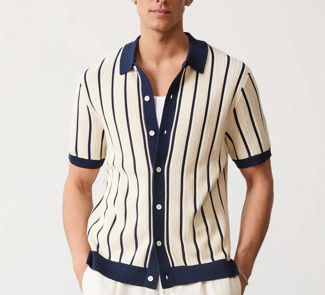 Men's white asymmetric lapel short sleeve knitted shirt laid flat.