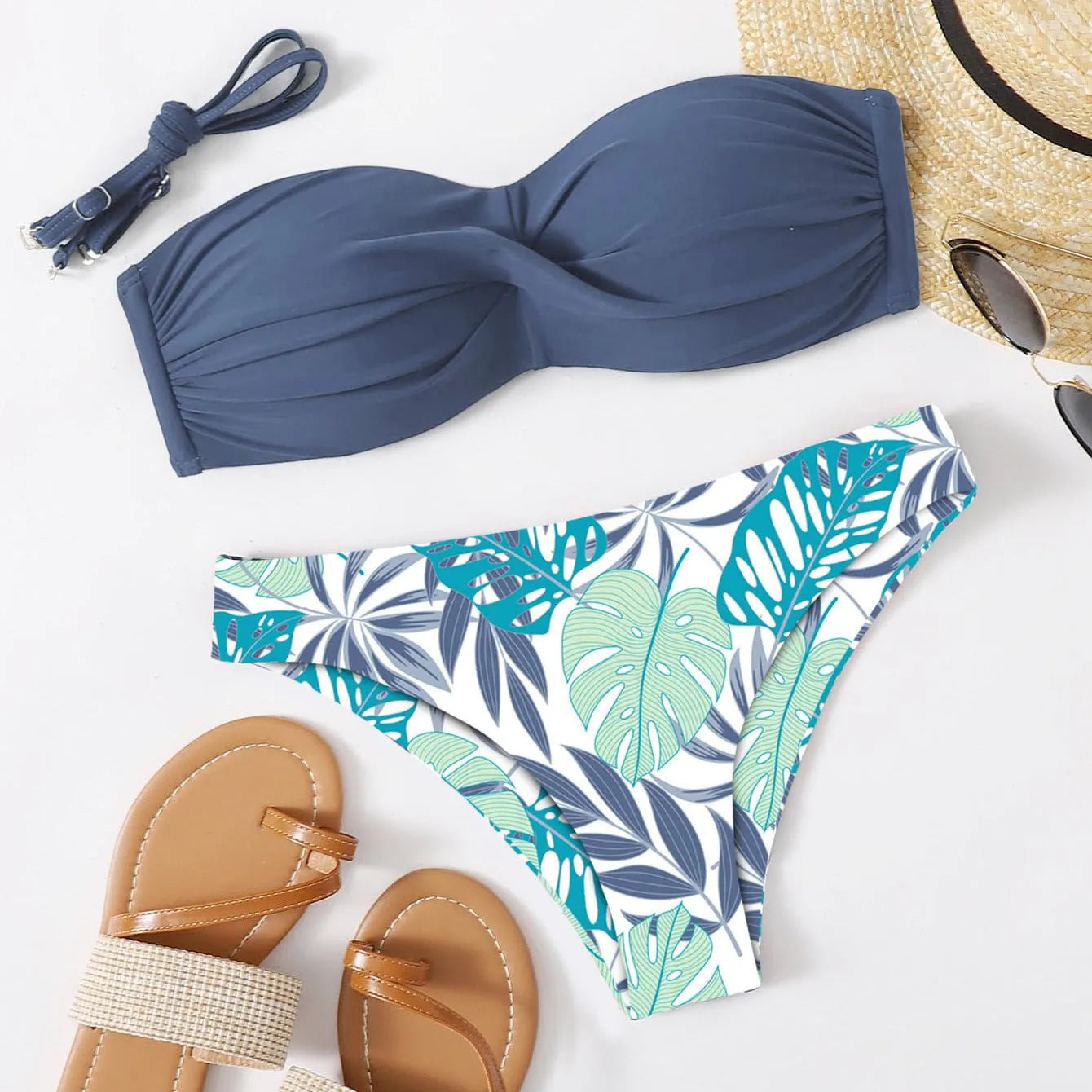 Green split push-up hard cup bikini top and coordinating briefs swimsuit laid flat.