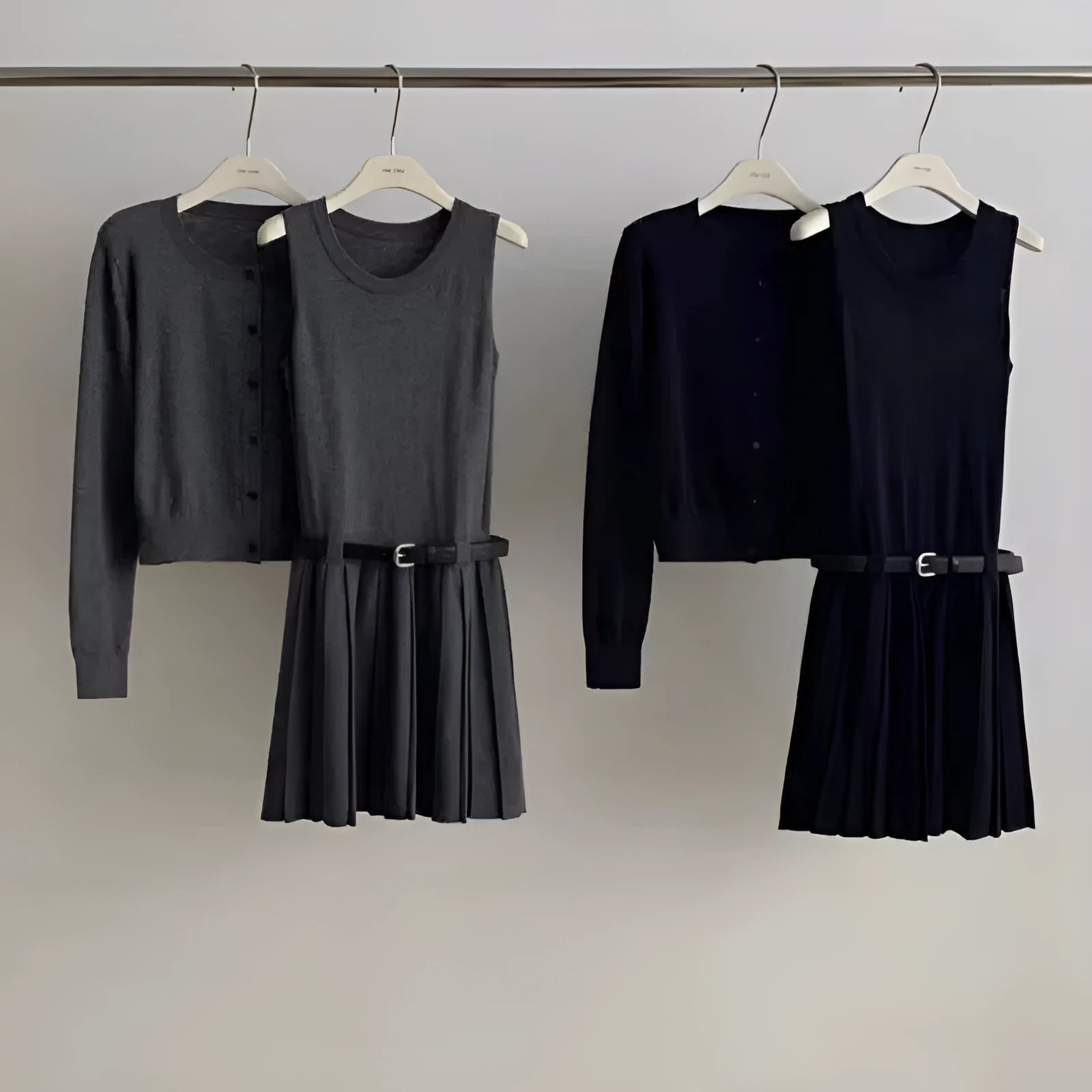 Grey knitted women's two-piece set with vest skirt, long-sleeved cardigan and pleated detail
