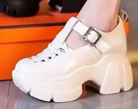 Women's black and white Roman style chunky heel pumps with satin upper and hollow out pattern