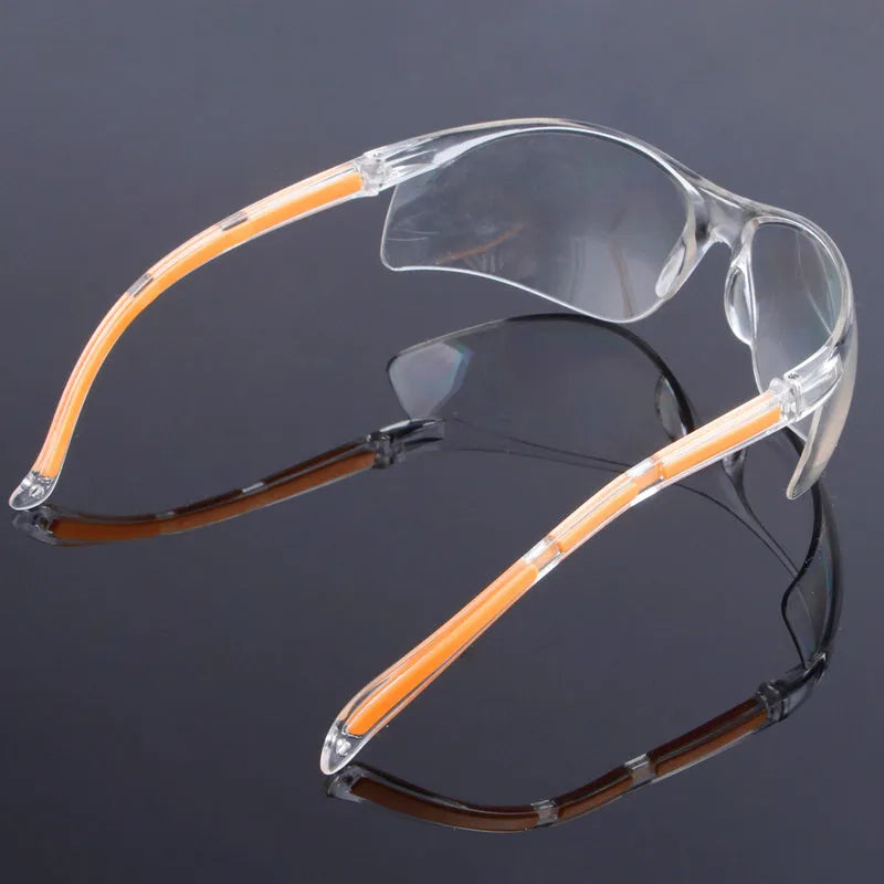 Transparent polycarbonate safety goggles with yellow tinted lenses for eye protection.