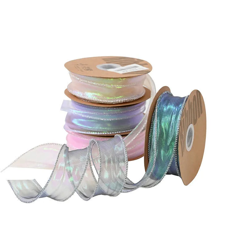 Roll of colourful wave patterned fishtail yarn decorative ribbon in mesh material, 4cm wide.