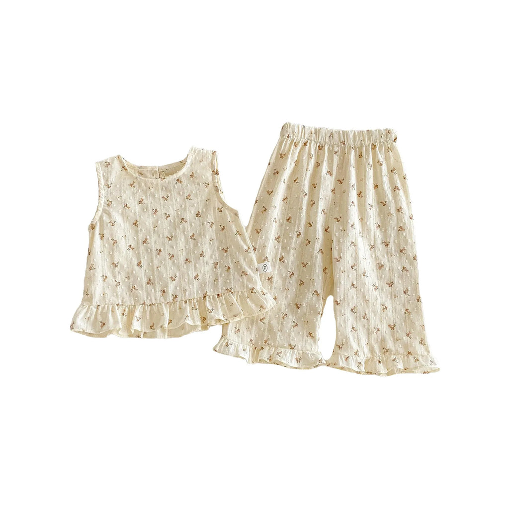 Children's cotton sleeveless top and trousers two-piece set in cream apricot on white background
