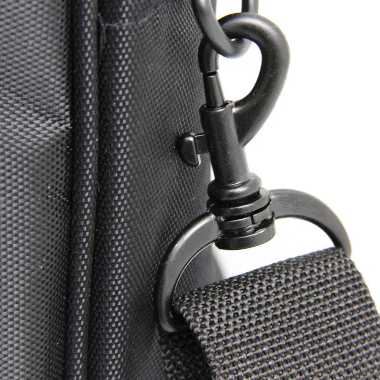 Black nylon one-shoulder computer bag for laptops up to 17.3 inches with hidden strap and shock protection