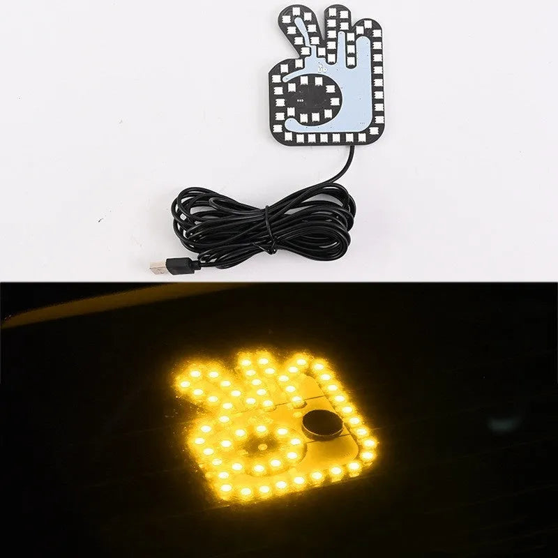 Car USB plug-in LED finger gesture lights showing thumbs up, OK, and scissor hand designs.