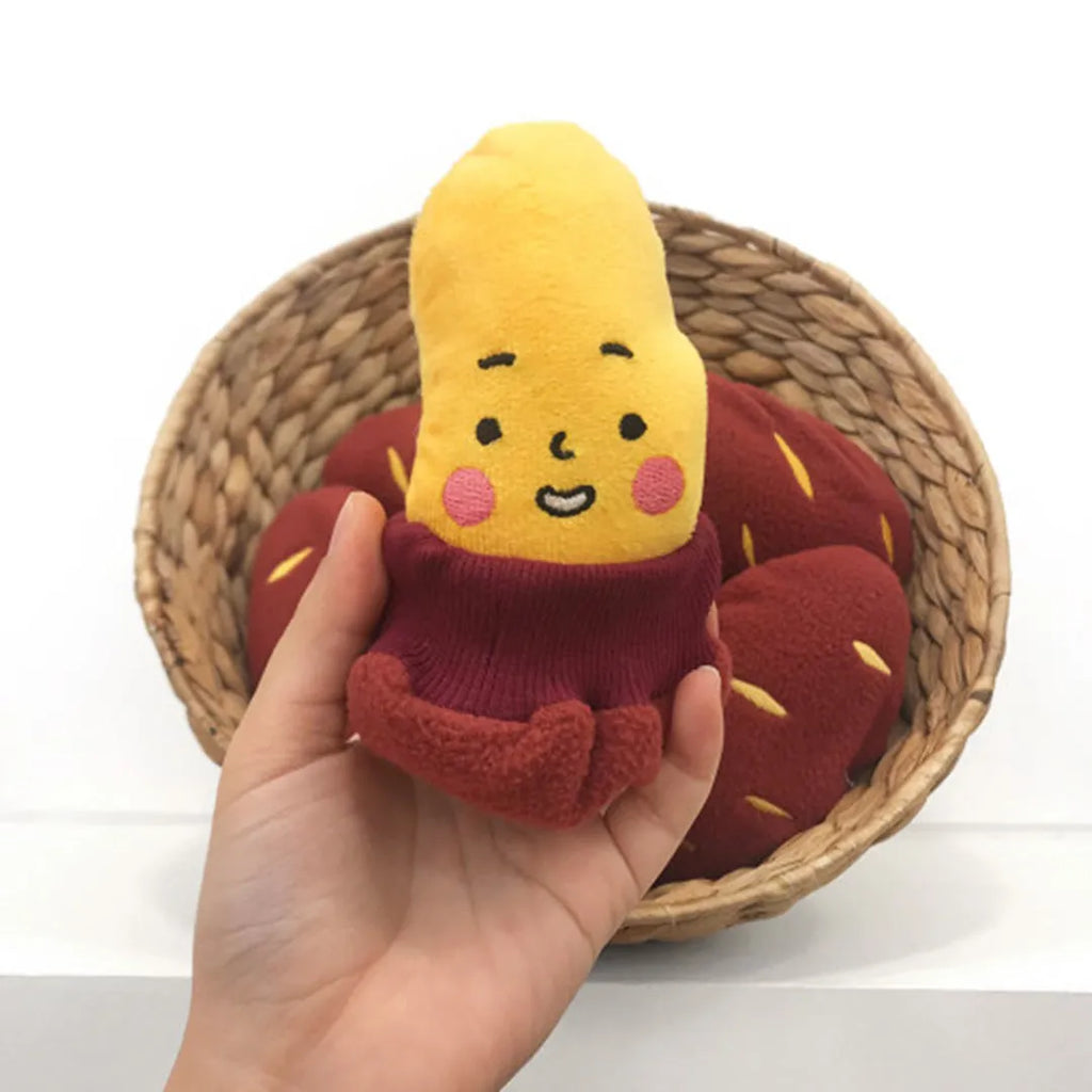 Red sweet potato shaped dog puzzle toy with hidden treat compartments