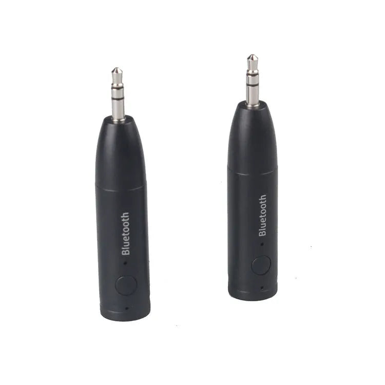 Black AUX Bluetooth 5.0 audio receiver for car or home stereo with USB cable.