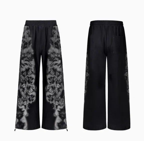 Streetwear co-ord set featuring printed loose trousers, a matching hoodie, and seven-inch shorts on a neutral background.
