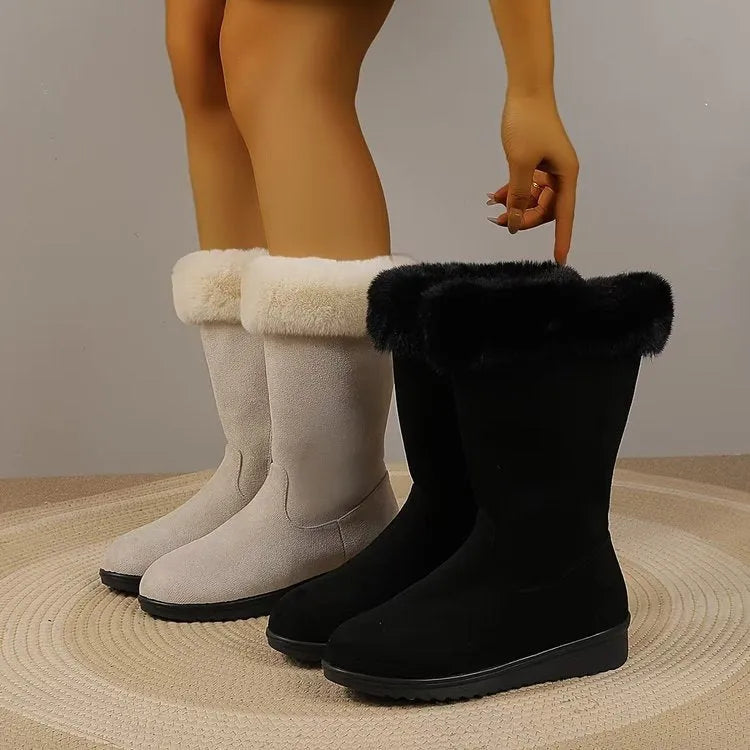 Fleece-lined mid-calf snow boots in black with waterproof platform sole and round toe, on a white background