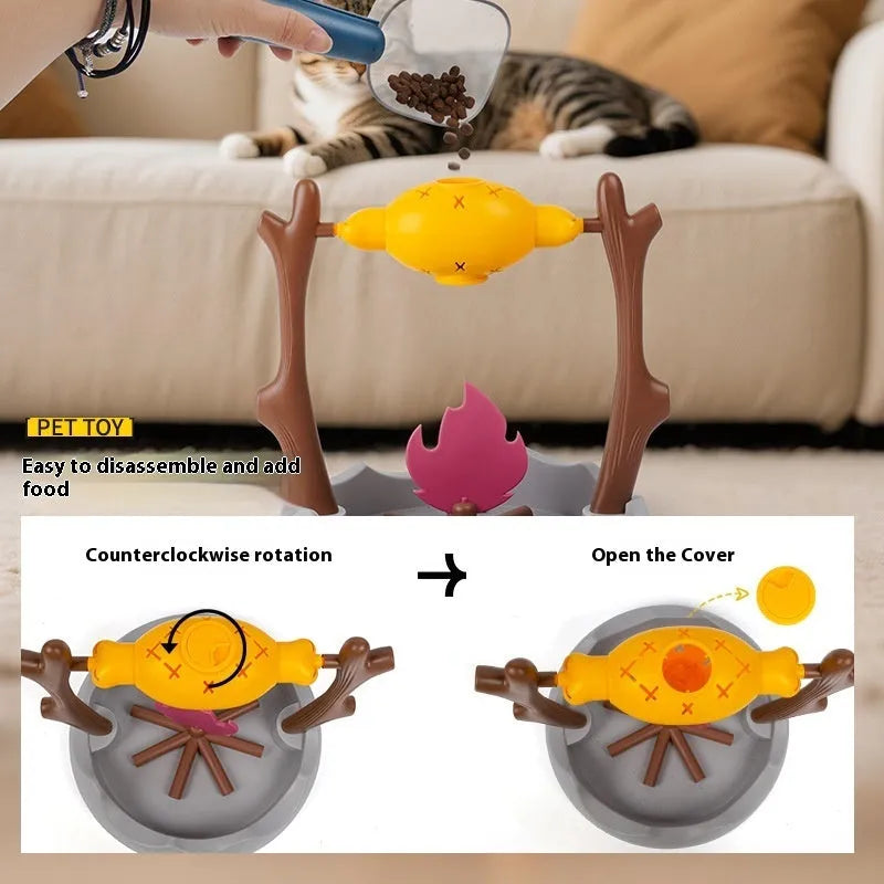 Barbecue-themed plastic tumbling cat treat feeder toy on a floor.