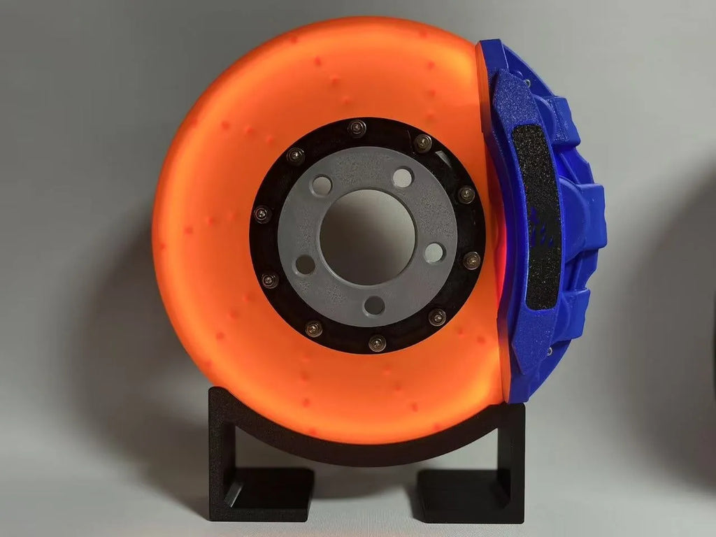 Brake disc design rechargeable LED night light with touch control in blue, red or yellow.