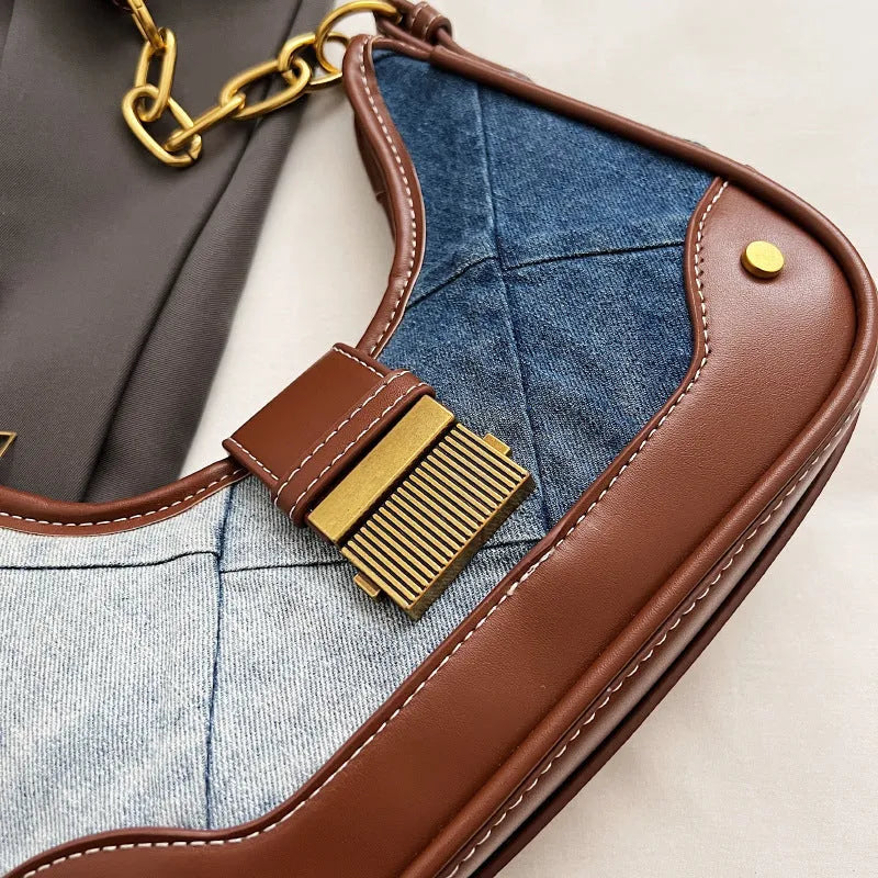 Brown denim women's shoulder bag with diamond mesh and chain detail, bucket shape.