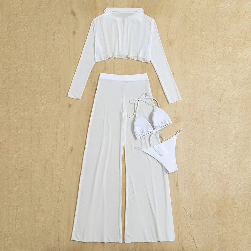 White women's four-piece swimsuit set showing backless top, high-waisted trousers, bra, and panties arranged together