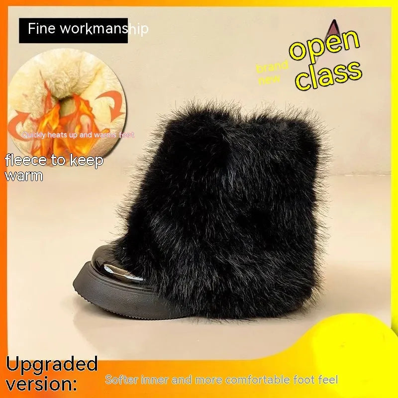 Black low-top snow boot with plush material and a waterproof rubber platform sole.
