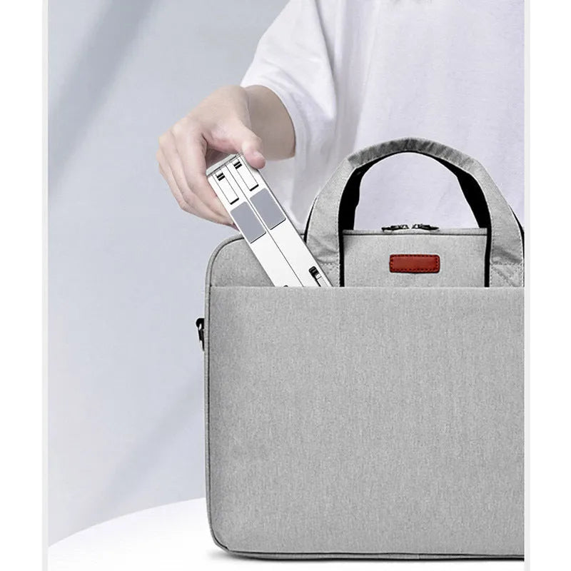 Foldable aluminium laptop stand in silver with silicone pads and cable management slot for 7-15 inch laptops