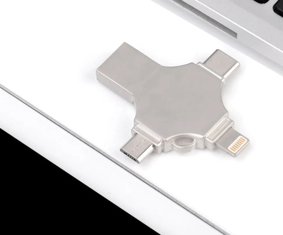 Silver metal 4-in-1 USB 3.0 flash drive with iOS, Micro USB, Type-C, and USB connectors for mobile phone and computer data transfer
